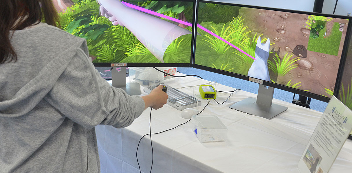 「ぶるなび3」のプレゼンテーション用ゲーム作品「バーチャル犬の散歩」。画面の中の犬の引っ張る力と方向を感じることができる