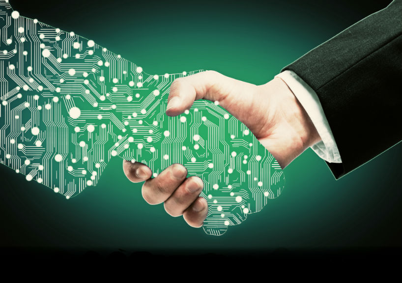 Businessman shaking digital partners hand on green background